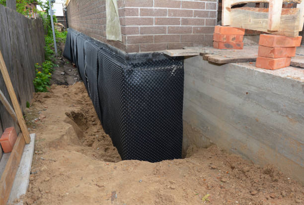 Happy homeowners after waterproofing job in Farmersville
